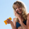 types of sunscreen // Woman in bikini with sunblock