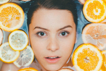 woman beauty bath orange vitamin c square