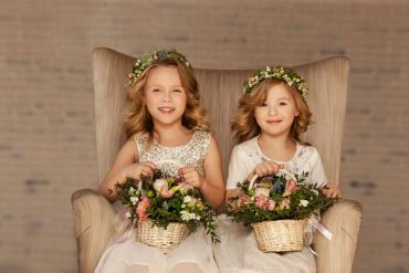 flower girl hairstyles two girls sitting together